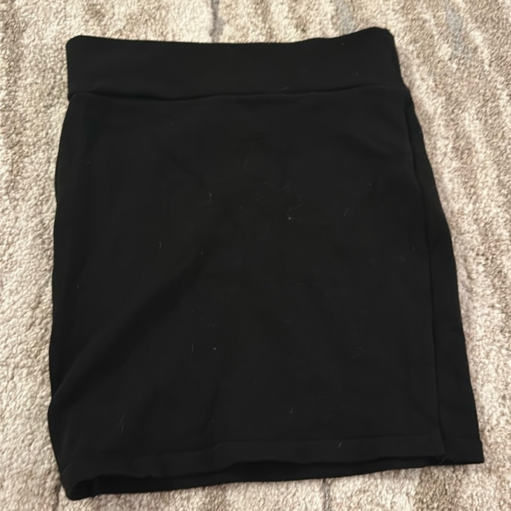 Black bandage mini skirt.